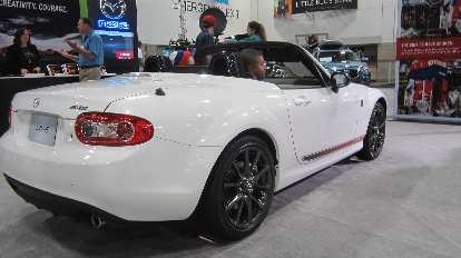 A white, special edition 2015 Mazda MX-5---the last year of the third generation MX-5. white 2015 Mazda MX-5