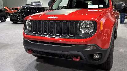 The cheerful face of a red 2016 Jeep Renegade. The cheerful face of a red 2016 Jeep Renegade.