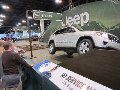 A Jeep Grand Cherokee going over a 30-degree ramp.