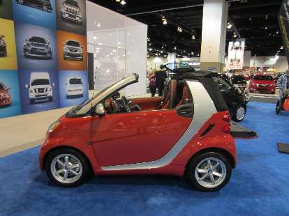 A Smart car is barely longer than a motorcycle! A Smart car is barely longer than a motorcycle!