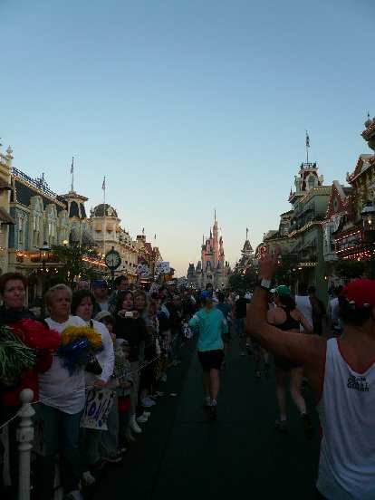 [Mile 10, 7:26 a.m.] Being cheered on by dense crowds before the Magic Kingdom.