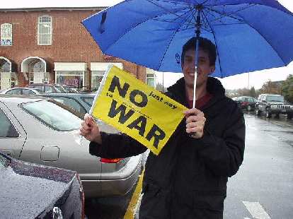 yellow No War sign, Dan, blue umbrella