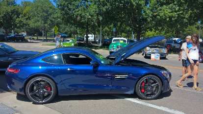 A blue 2014 AMG GTS coupe.
