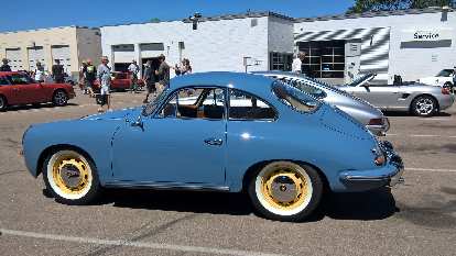 A blue 1965 Porsche 365 with yellow rims. A blue 1965 Porsche 365 with yellow rims.