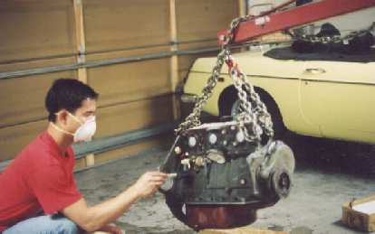 Photo: Felix Wong prepping the just-rebuilt engine with acid for painting.