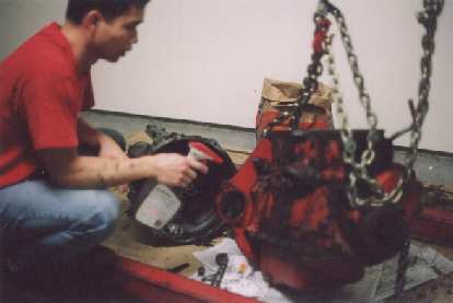 Here's a picture taken after I unbolted the tranny from the engine and did hours worth of cleaning. Note that the engine is now red and the transmission silver!