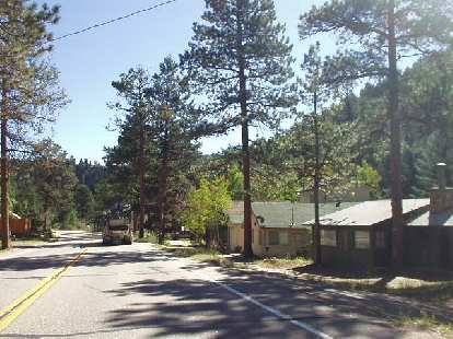 Homes among the pine along US Route 34 to Loveland, which is about 30 miles from Estes.