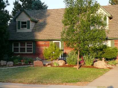 Well-done with a mixture of large rock, brush and mulch... looks pretty low-maintenance to me. Well-done with a mixture of large rock, brush and mulch... looks pretty low-maintenance to me.