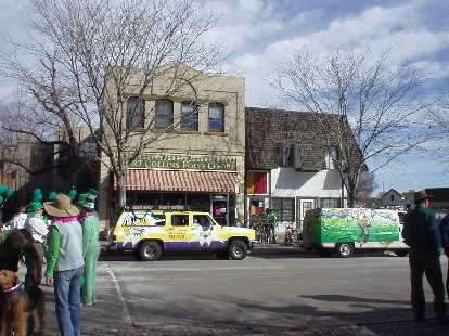 Floats lining up in front of the Fort Collins Food Co-op wait for their turn to enter the parade.