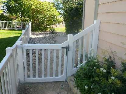 An "after" shot of the front of the side gate and fence.