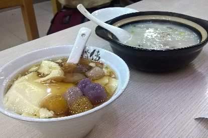 Some sort of sweet tofu in syrup desert, and congee (juk in Cantonese).