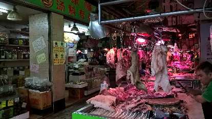 Raw pig hung up at a market in Guangzhou, China.