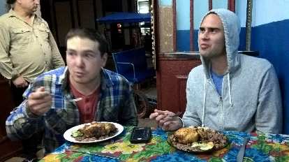 Matt and Alex eating ropa vieja de pollo at a Criole restaurant on Calle Virtudes (near Calle Industria).