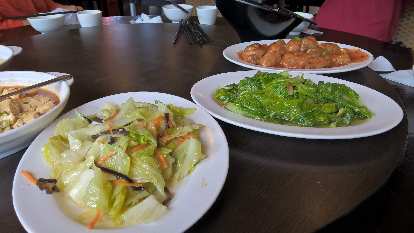 Cooked nappa cabbage, cooked lettuce and chicken.