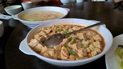 Egg drop soup and a tofu dish.
