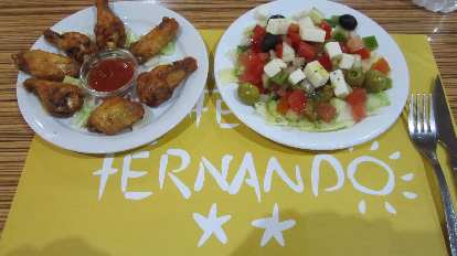 Chicken wings and Greek salad tapas at Caf̩ Fernando in Barcelona.