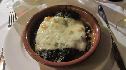 Some sort of stew with cheese.