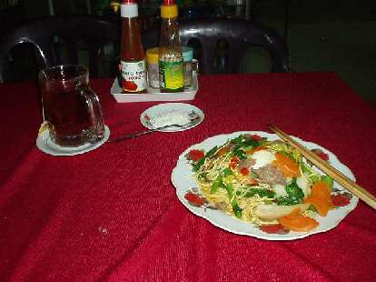 Dining al fresco in Hoi An: noodles with beef and Lipton tea.