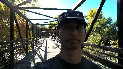 Felix Wong on the bridge at Butterfly Woods Natural Area, which is part of the Poudre River Trail.