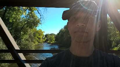 Felix Wong at Butterfly Woods with the Poudre River in the background.