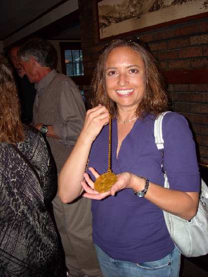 Raquel with Frank's gold medal from the 1972 Olympic marathon in Berlin. Raquel with Frank's gold medal from the 1972 Olympic marathon in Berlin.