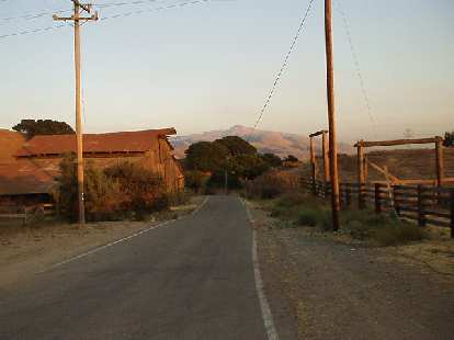 [Aug. 2002] Morrison Canyon Rd. is a great road for hill-training, just 2 miles from my house.  It shoots up almost 800 feet in 1.75 miles! This is a nice south-facing shot at the top before a sunset.