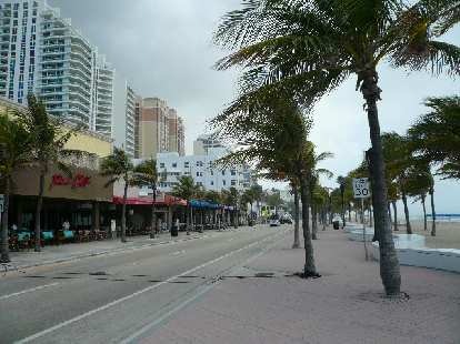 There were lots of restaurants and shops selling bathing suits across from the beach. There were lots of restaurants and shops selling bathing suits across from the beach.