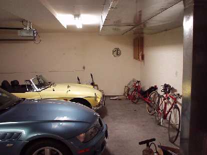 When I had moved in 2001, the garage was in unremarkable shape: lots of clutter, an ugly particle-board cabinet, and errant wire and spackle on the ho-hum white walls.  This would change!