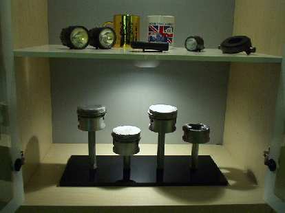 The Garage Mahal theme extends into rest of the house with Goldie's pistons (after they blew up) on display. I may post some pics of my newly-painted living room, one day... (01 Jun 2004) The Garage Mahal theme extends into rest of the house with Goldie's pistons (after they blew up) on display. I may post some pics of my newly-painted living room, one day...