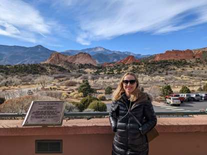 Andrea at the Garden of the Gods Visitor Center, with Garden of the Gods in the background.