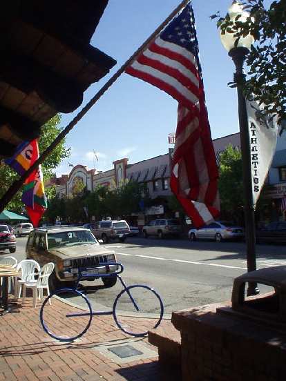 American flag with a bike rack shaped as a bicycle.