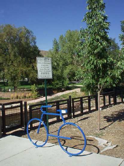 Another bike rack shaped as a bicycle in front of a park. I love these! Another bike rack shaped as a bicycle in front of a park. I love these!