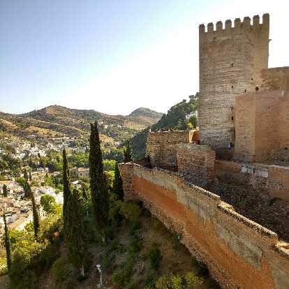 Stone tower walls of Alcazaba, south of the Albaicín district in Granada, Spain.