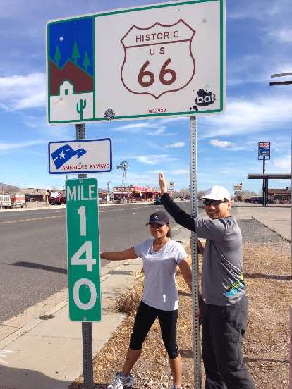 Sara and Bandy by a sign for Historic Route 66.