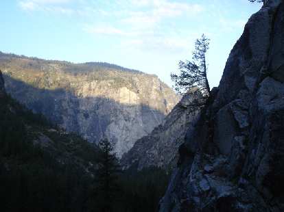 A rising sun lit up the granite faces around the Yosemite Valley as we hiked on in.