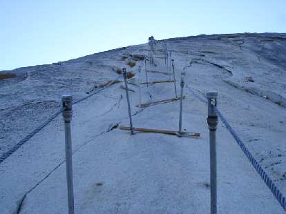 We descended Half Dome the hiker's way by means of these cables.  And after the 6 miles of hiking + 8 pitches (and 800 vertical feet) of rock climbing, we still had 9 -- no wait, 11 due to getting lost -- miles of hiking left to get back to the car, 3 miles of which were in darkness!