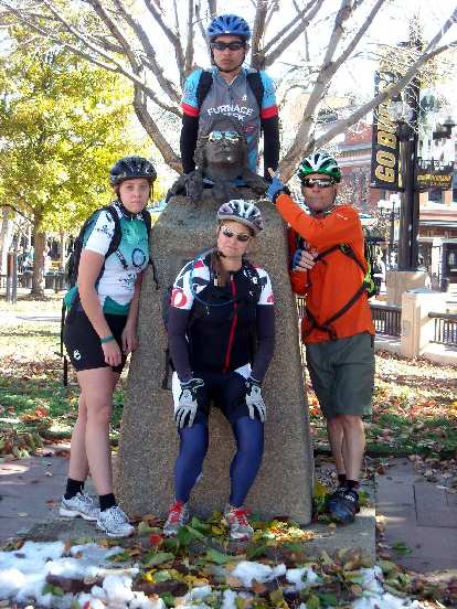 Our team posing with a serious-looking statue.