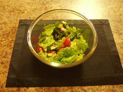 Green lettuce, black beans, tomatoes, and avocado.
