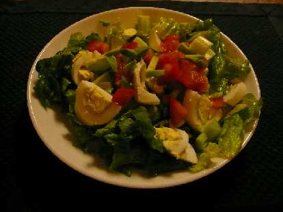 Chef salad with green lettuce, hard-boiled eggs, tomatoes, avocado, and celery. Chef salad with green lettuce, hard-boiled eggs, tomatoes, avocado, and celery.