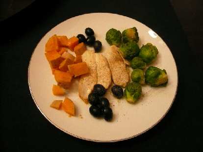 Steamed butternut squash, brussel sprouts, olives, and chicken.  Colorful, quick, and delish!