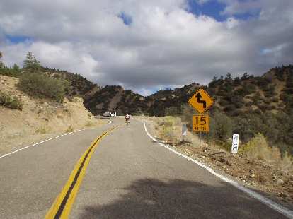 Mile 125, 4:03 p.m.: Highlight climb of the day, the climb the ride is named after: Heartbreak Hill. This is just the beginning; at the van is a water stop. I didn't stop. Mile 125, 4:03 p.m.: Highlight climb of the day, the climb the ride is named after: Heartbreak Hill. This is just the beginning; at the van is a water stop. I didn't stop.