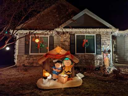 A holiday display with Snoopy, Lucy, and Charlie brown.