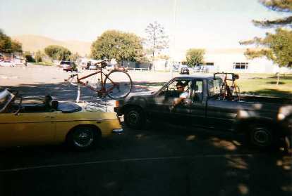 yellow 1969 MGB roadster, red Cannondale 3.0, luggage rack, bike rack, Ken Loo, Toyota truck