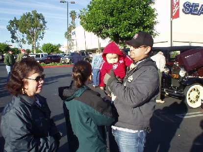 During the last weekend of 2003, I boarded a jet to spend some time with sweet Sharon and her wonderful family. Here's Mary Jane, Karen, little Emmalee, and Allen awaiting the start of the annual Holiday Motor Excursion in Pasadena. During the last weekend of 2003, I boarded a jet to spend some time with sweet Sharon and her wonderful family. Here's Mary Jane, Karen, little Emmalee, and Allen awaiting the start of the annual Holiday Motor Excursion in Pasadena.