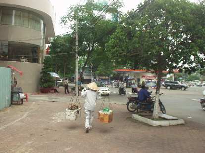 How the Vietnamese carry multiple packages. How the Vietnamese carry multiple packages.
