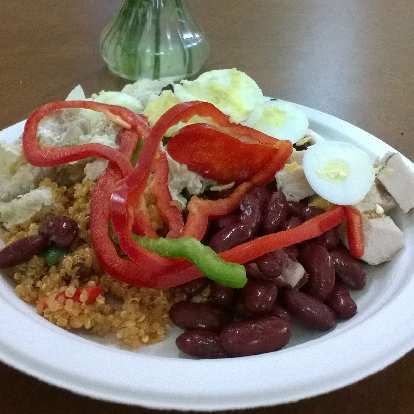 cafeteria food with green and red bell peppers, kidney beans, eggs, rice