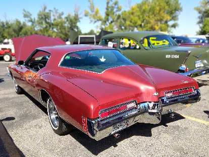 A red Buick Riviera from the early 1970s. Rivieras of any vintage had a lot of style, especially for a Buick.