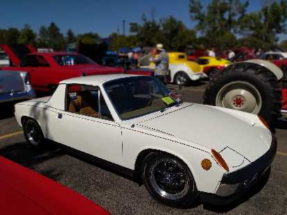 A white Porsche 914, one of the nicest I've seen. It had a custom Colorado European-style license plate (with the same license numbers as the rear, legal American plate).
