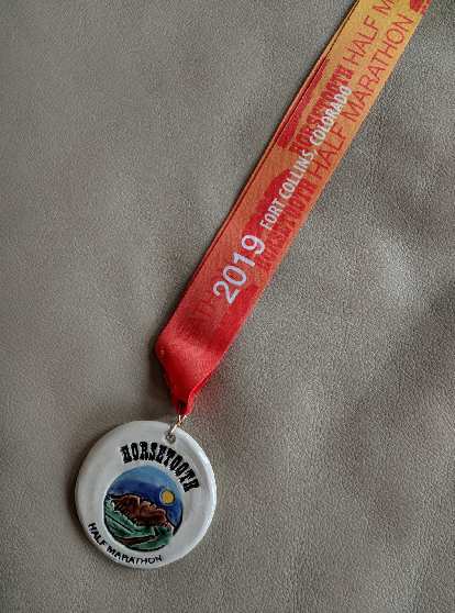 The finishing medal for the 2019 Horsetooth Half Marathon.