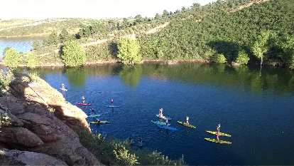 Yogis on paddleboards paddling back to Satanka Cove at Horsetooth Reservoir. Yogis on paddleboards paddling back to Satanka Cove at Horsetooth Reservoir.